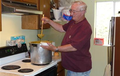 Ron is serving up soup to the clients. Every Wednesday. Ron prepares delicious homemade soup and bread. We welcome our clients in for a hearty meal, fellowship and food boxes.